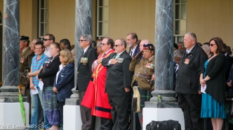 Dave Revell (MOTHs), Alderman Ian Neilson, Mr Shaun Booth and Lt Col Tienie Lott salute during the National Anthem