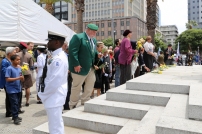 Members of the public laying flowers at the memorial